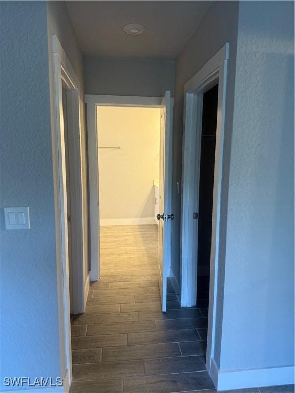 hallway featuring dark wood-type flooring