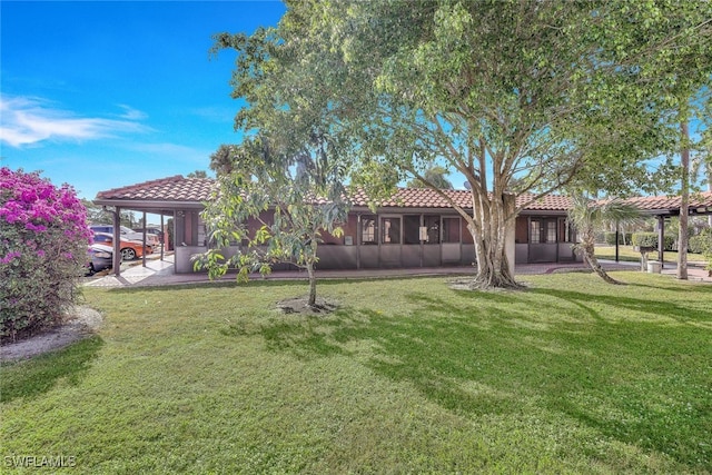 view of yard with a sunroom