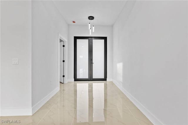 foyer entrance featuring french doors