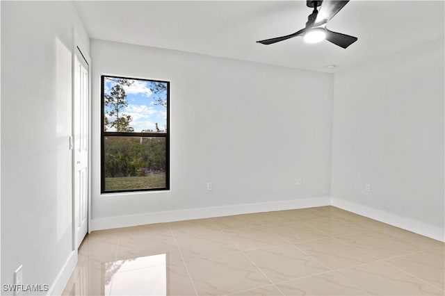 spare room featuring ceiling fan