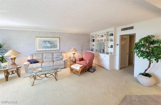 living room with crown molding, light colored carpet, and a textured ceiling