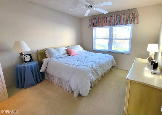 carpeted bedroom with ceiling fan