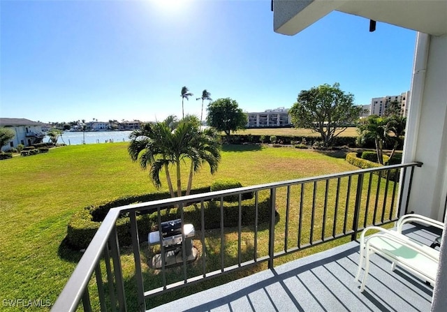 balcony with a grill and a water view