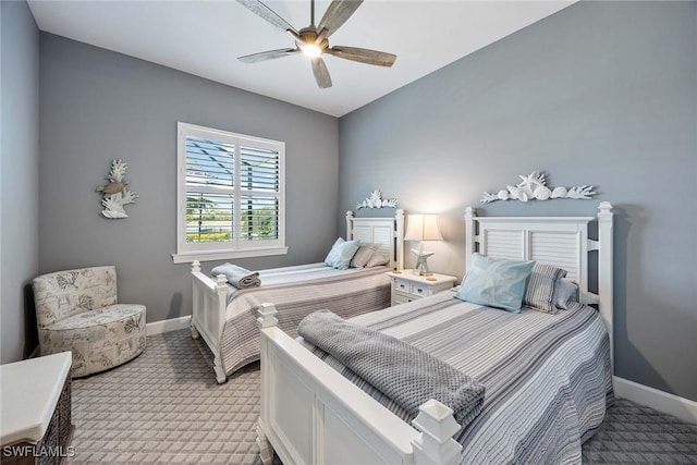 bedroom featuring ceiling fan and light colored carpet