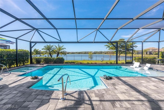 view of pool with a lanai, a patio area, and a water view