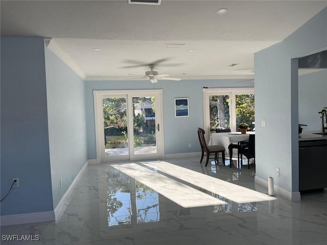 dining space featuring ceiling fan, plenty of natural light, french doors, and ornamental molding