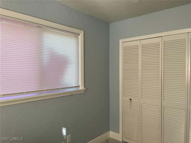 unfurnished bedroom featuring a closet