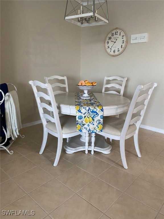 dining space featuring tile patterned floors