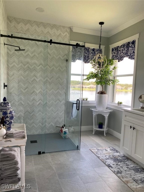 bathroom with a water view, crown molding, and an enclosed shower