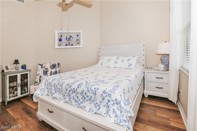 bedroom featuring ceiling fan and dark hardwood / wood-style floors