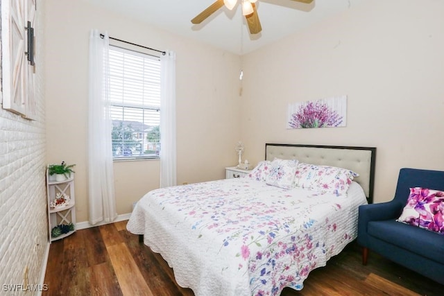 bedroom featuring dark hardwood / wood-style flooring and ceiling fan