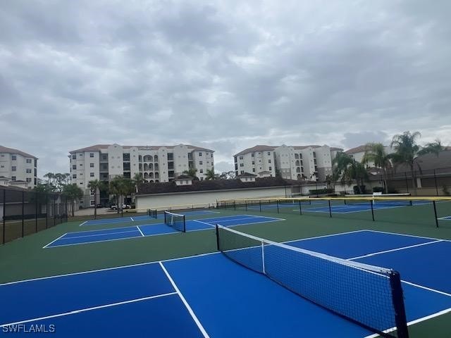 view of sport court featuring basketball hoop