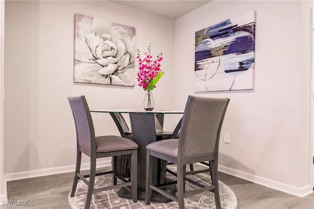 dining room with hardwood / wood-style flooring