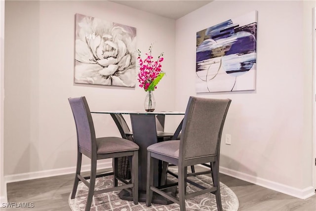16351 Coconut Palm Dr, Port Charlotte, FL 33953 - dining area featuring baseboards and wood finished floors