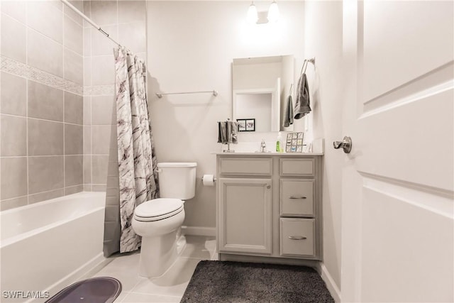 full bathroom featuring toilet, tile patterned floors, vanity, and shower / tub combo with curtain