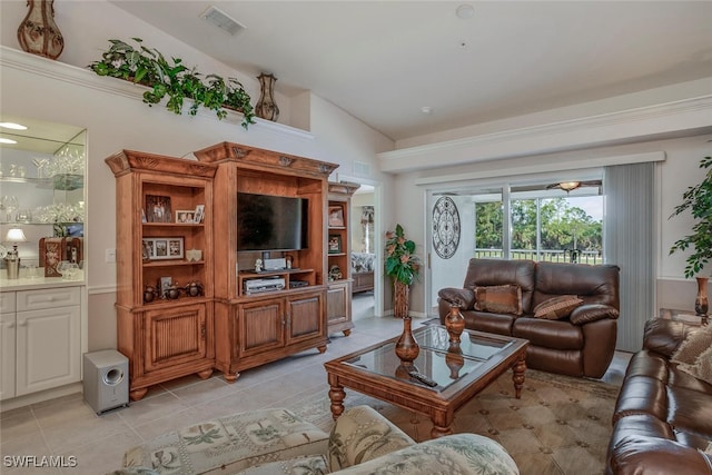 living room with light tile patterned flooring and lofted ceiling