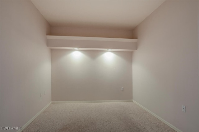 spare room with carpet flooring and baseboards