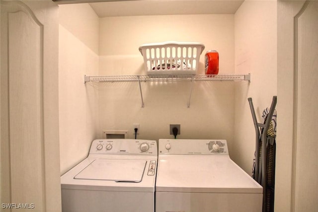 washroom featuring washer and clothes dryer