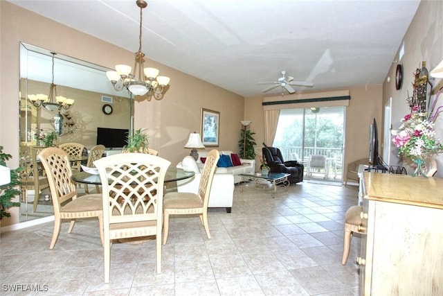 tiled dining room featuring ceiling fan with notable chandelier