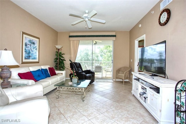 living room with ceiling fan and light tile patterned flooring