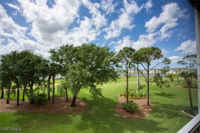 view of home's community with a lawn