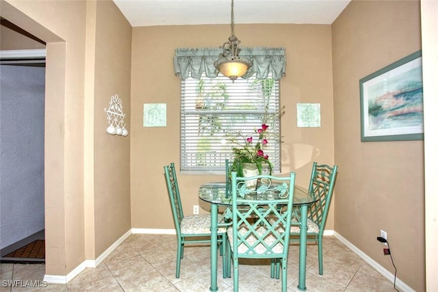 dining space with tile patterned floors