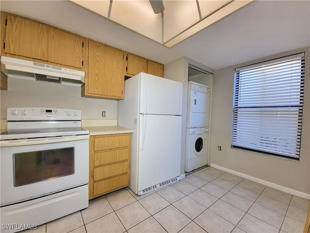 kitchen with stacked washer / drying machine, white appliances, light tile patterned flooring, and ceiling fan