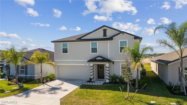 view of property with a garage and a front yard