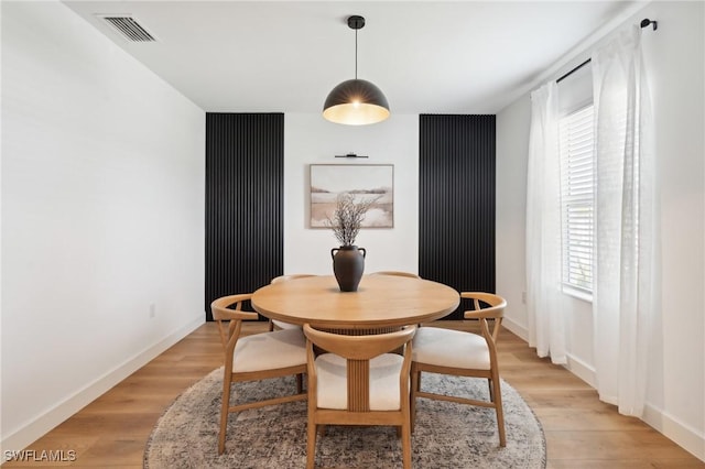 dining space featuring light hardwood / wood-style flooring and a wealth of natural light