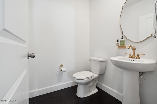 bathroom with tile patterned floors and toilet