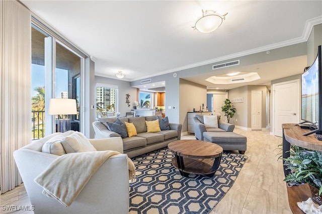 living room featuring light hardwood / wood-style flooring and ornamental molding