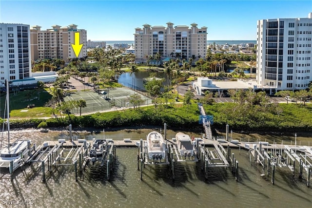 birds eye view of property with a water view