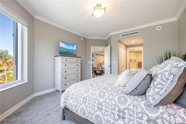 carpeted bedroom featuring ornamental molding