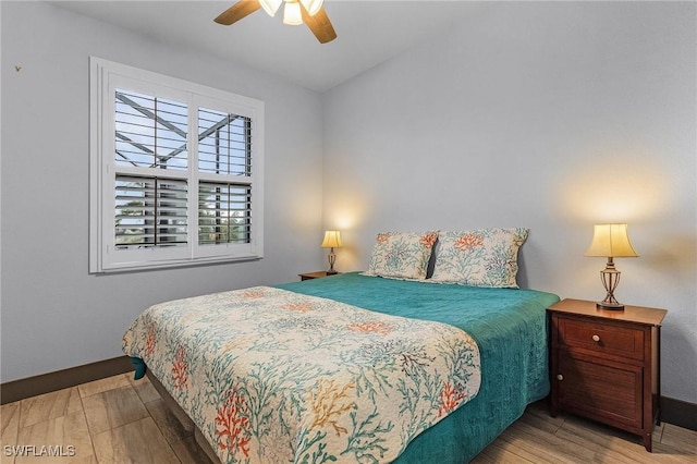 bedroom featuring light hardwood / wood-style flooring and ceiling fan