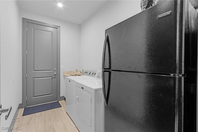 laundry room with separate washer and dryer