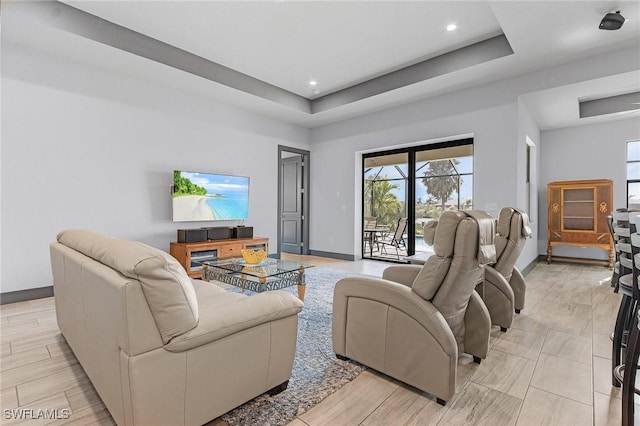 living room with a tray ceiling