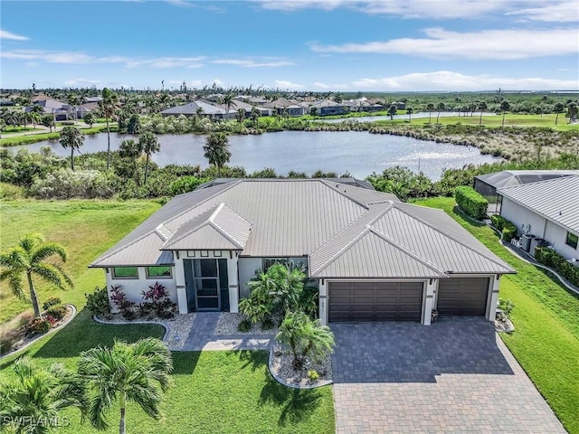 birds eye view of property with a water view