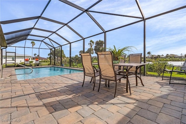 view of swimming pool with a lanai and a patio area