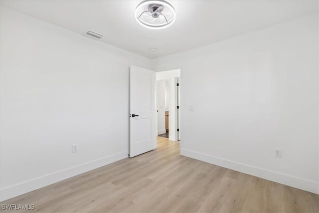 unfurnished room featuring light wood-type flooring