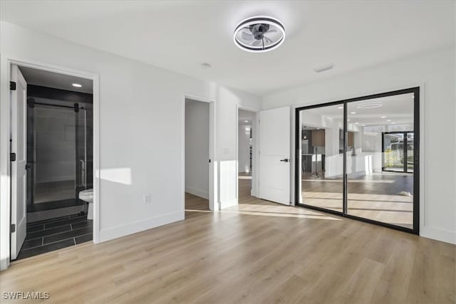 spare room with light wood-type flooring