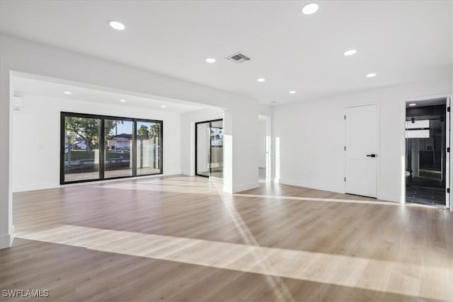 spare room featuring light hardwood / wood-style floors