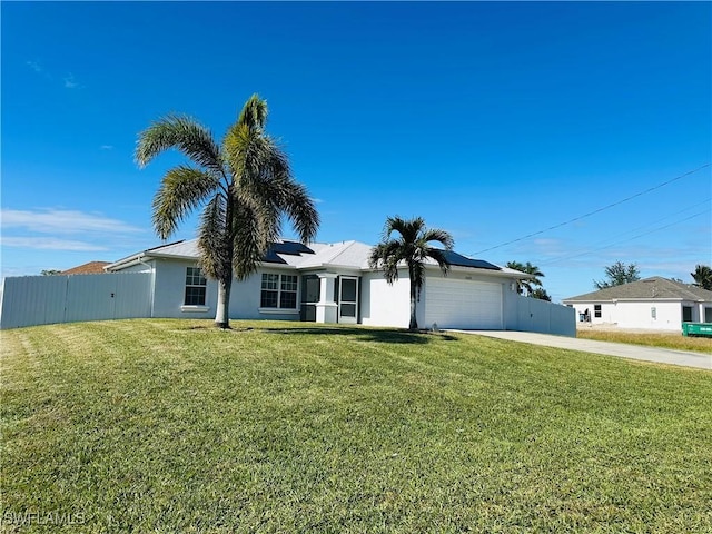 single story home featuring a front yard and a garage