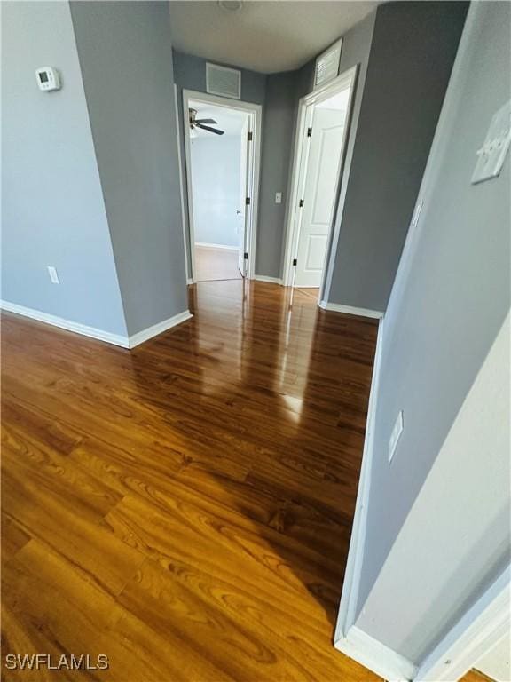 empty room featuring hardwood / wood-style flooring and ceiling fan