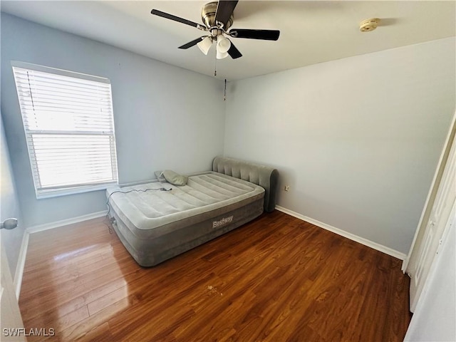 bedroom featuring ceiling fan and hardwood / wood-style flooring