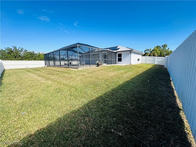 view of yard featuring glass enclosure