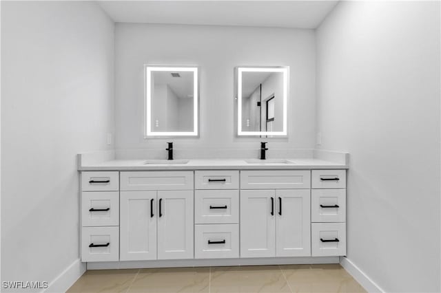 bathroom with tile patterned flooring and vanity