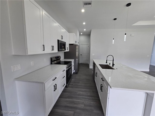 kitchen featuring pendant lighting, white cabinetry, sink, stainless steel range with electric stovetop, and light stone countertops