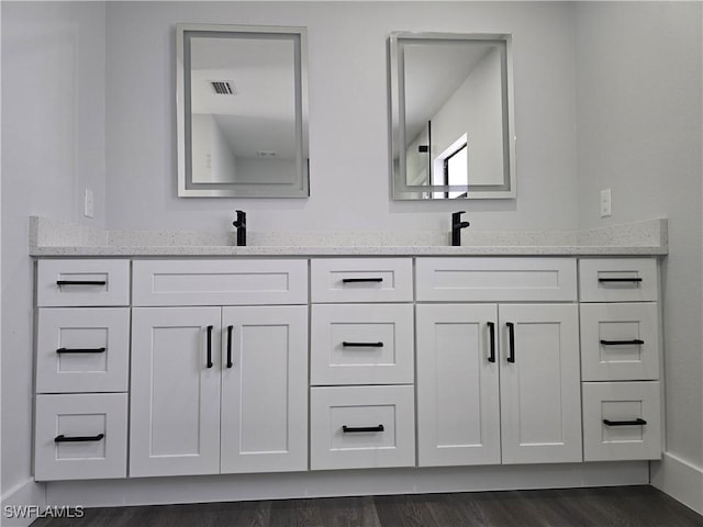 bathroom featuring hardwood / wood-style flooring and vanity