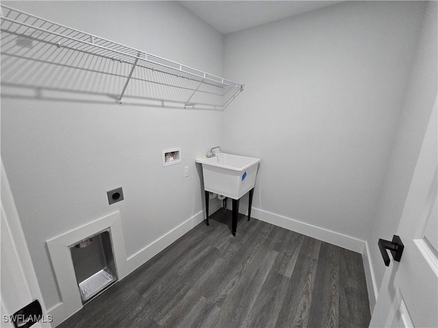 washroom featuring washer hookup, dark hardwood / wood-style floors, and electric dryer hookup