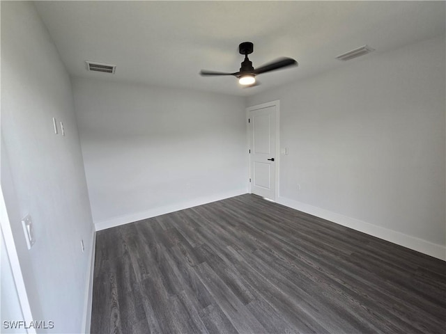 unfurnished room featuring dark hardwood / wood-style flooring and ceiling fan